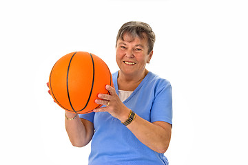 Image showing Senior woman playing basketball