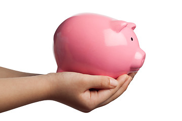 Image showing Child holding a piggy bank