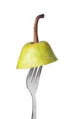 Image showing Pear held by a fork