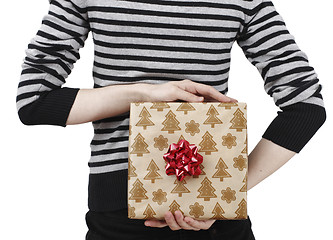 Image showing Young woman holding a present