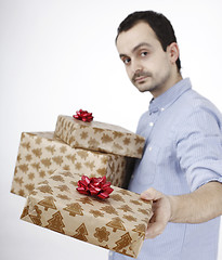 Image showing Young man holding a present