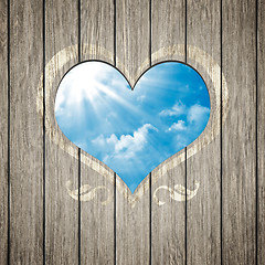 Image showing wooden heart with the blue sky