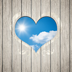 Image showing wooden heart with the blue sky