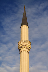 Image showing Minaret of mosque against sky with clouds