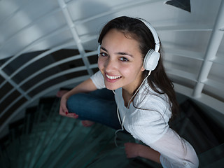 Image showing relaxed young woman at home working on laptop