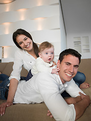 Image showing happy young family at home