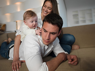 Image showing happy young family at home