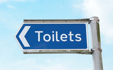 Image showing Signpost points to public toilets