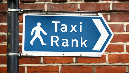 Image showing Signpost points to a taxi rank