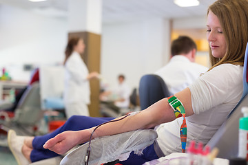 Image showing Nurse and blood donor at donation.