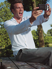 Image showing young guy taking photo llk