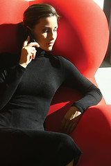 Image showing businesswoman talking on mobile phone wmnb