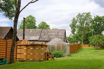 Image showing rural wooden fence separates the two courtyards  