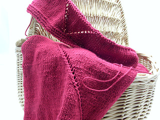 Image showing Red knitting with whole pattern in a wooden basket