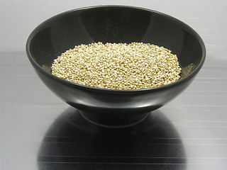 Image showing Bowl of chinaware with quinoa on reflecting matting