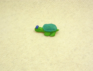 Image showing Hand made ceramic turtle on soft background