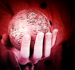 Image showing Globe in a girl's hands