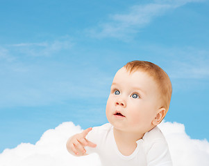 Image showing curious baby looking up