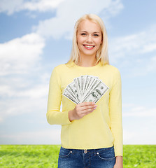 Image showing smiling girl with dollar cash money