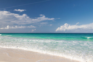 Image showing blue sea or ocean, white sand and sky with clouds