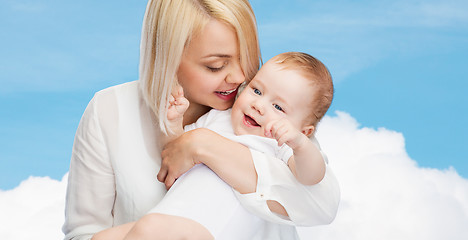 Image showing happy mother with smiling baby