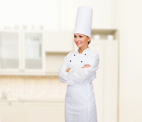 Image showing smiling female chef with crossed arms