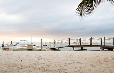 Image showing boats moored to pier