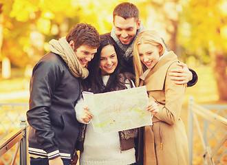 Image showing couples with tourist map in autumn park