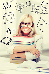 Image showing student with stack of books and doodles