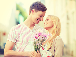 Image showing couple with flowers in the city