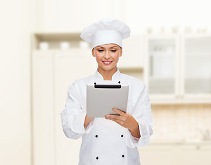 Image showing smiling female chef with tablet pc computer