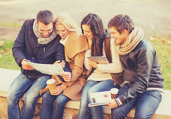 Image showing couples with tourist map in autumn park