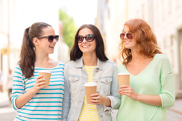 Image showing smiling teenage girls with on street