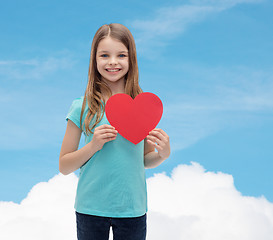 Image showing smiling little girl with red heart