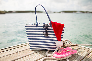 Image showing close up of beach accessories and santa helper hat