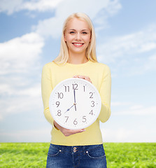 Image showing student with wall clock