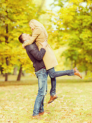 Image showing romantic couple playing in the autumn park