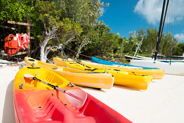 Image showing canoes on sandy beach