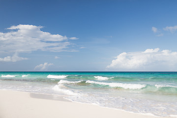 Image showing blue sea or ocean, white sand and sky with clouds