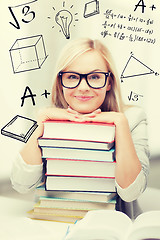 Image showing student with stack of books and doodles