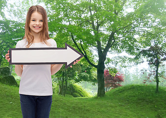 Image showing smiling girl with blank arrow pointing right