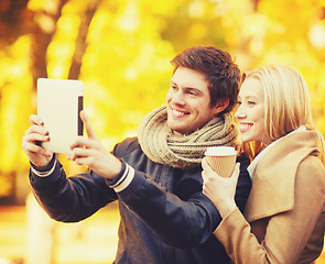 Image showing couple taking photo picture autumn park