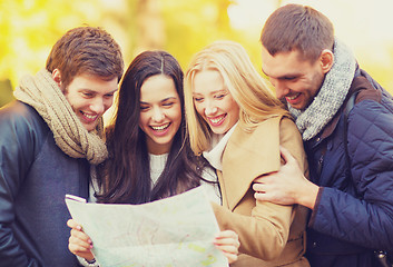 Image showing couples with tourist map in autumn park