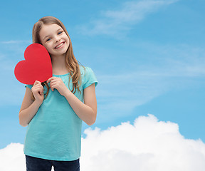 Image showing smiling little girl with red heart