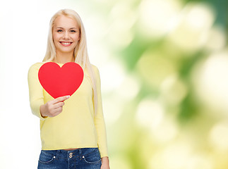 Image showing smiling woman with red heart