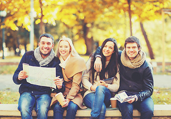 Image showing couples with tourist map in autumn park