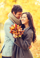 Image showing romantic couple kissing in the autumn park