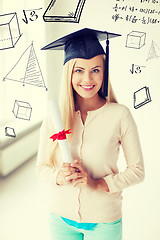 Image showing student in graduation cap with certificate