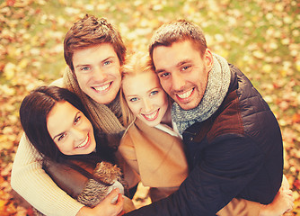 Image showing group of friends having fun in autumn park