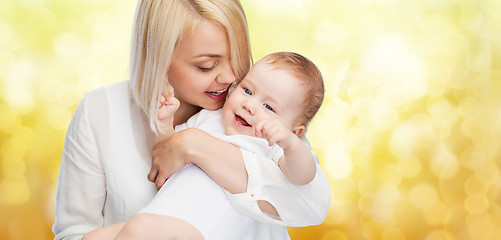 Image showing happy mother with smiling baby